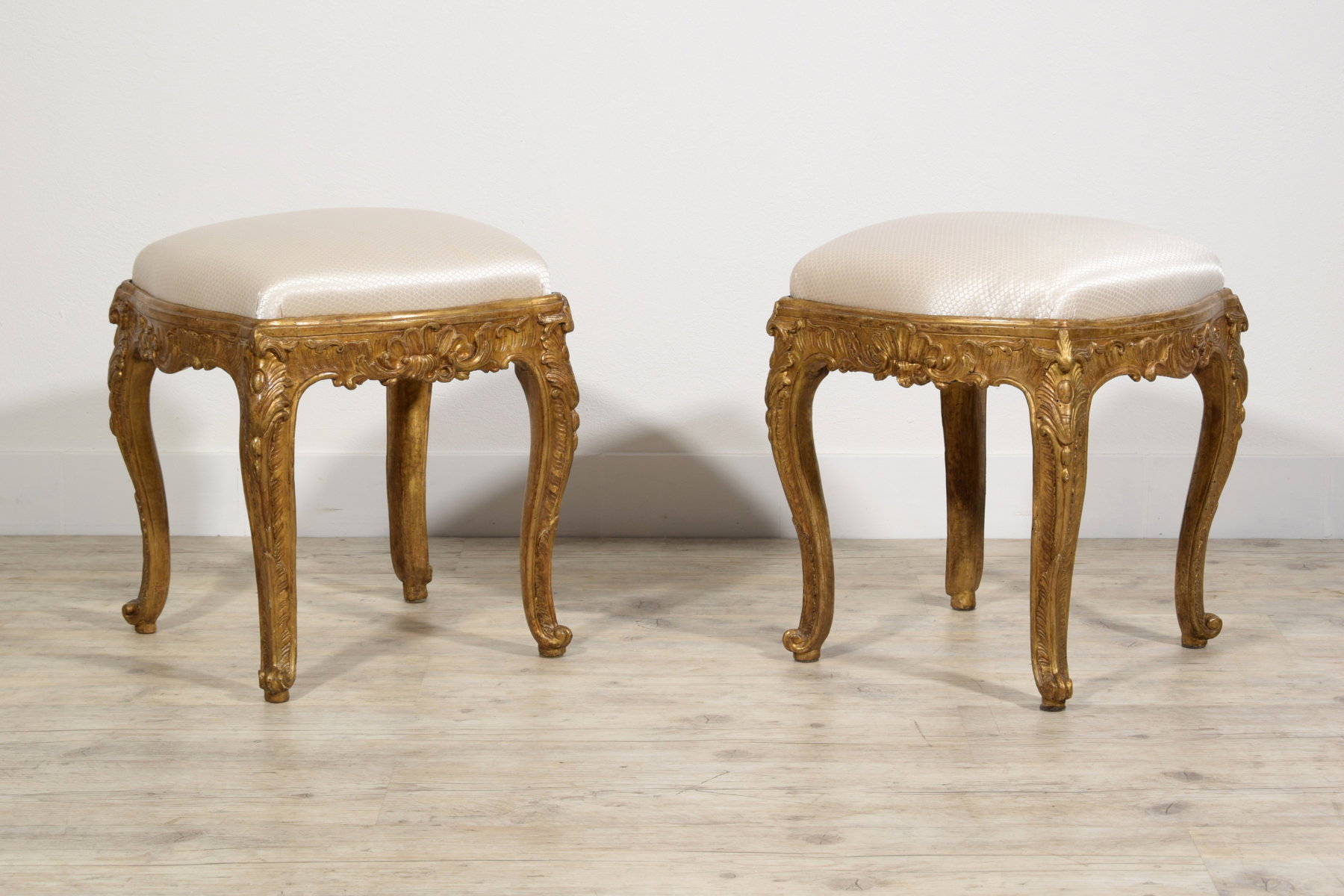 Pair of carved and Mecca gilded wooden stools, Naples, 18th century